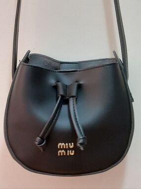 NEW Miu Miu Black Crossbody Bag Front Gold Metal Logo Drawstring Closure